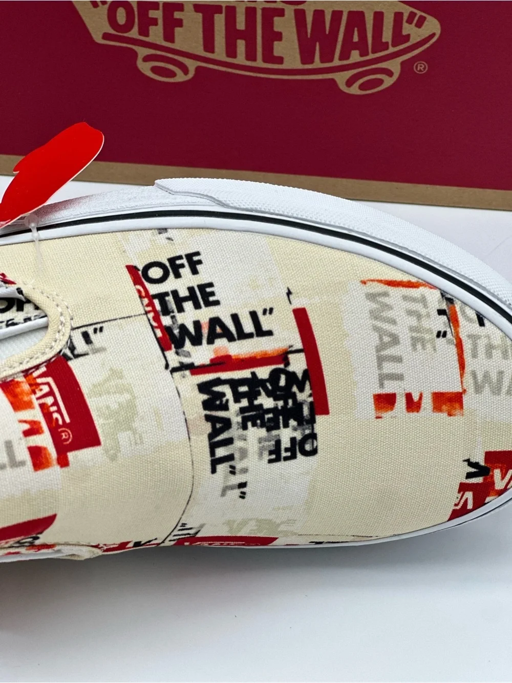 Vans Slip-On Sneakers in Cream, Red & Black Graphic Print